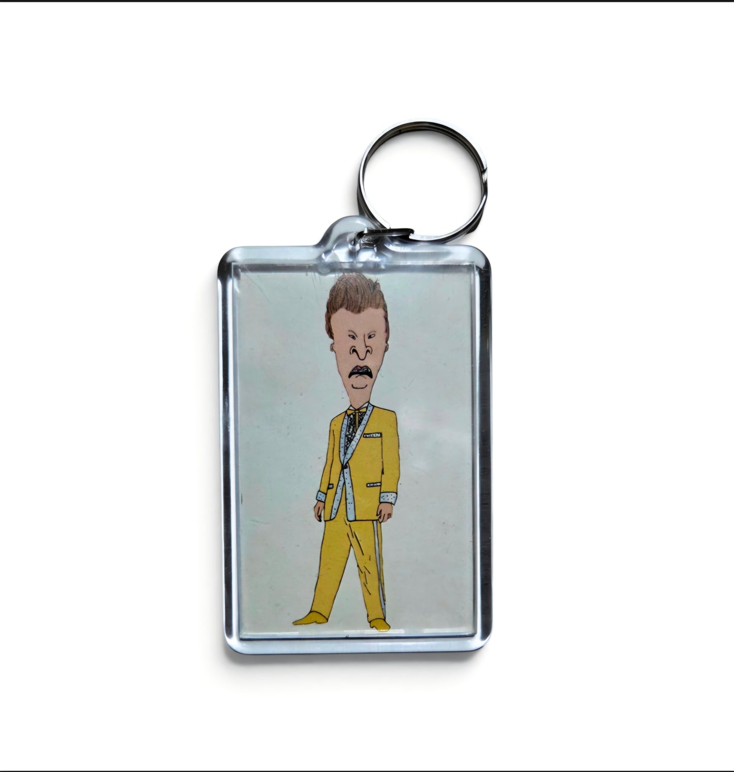 Key chain featuring a drawing of Beavis from Beavis and Butt-Head styled in a yellow suit